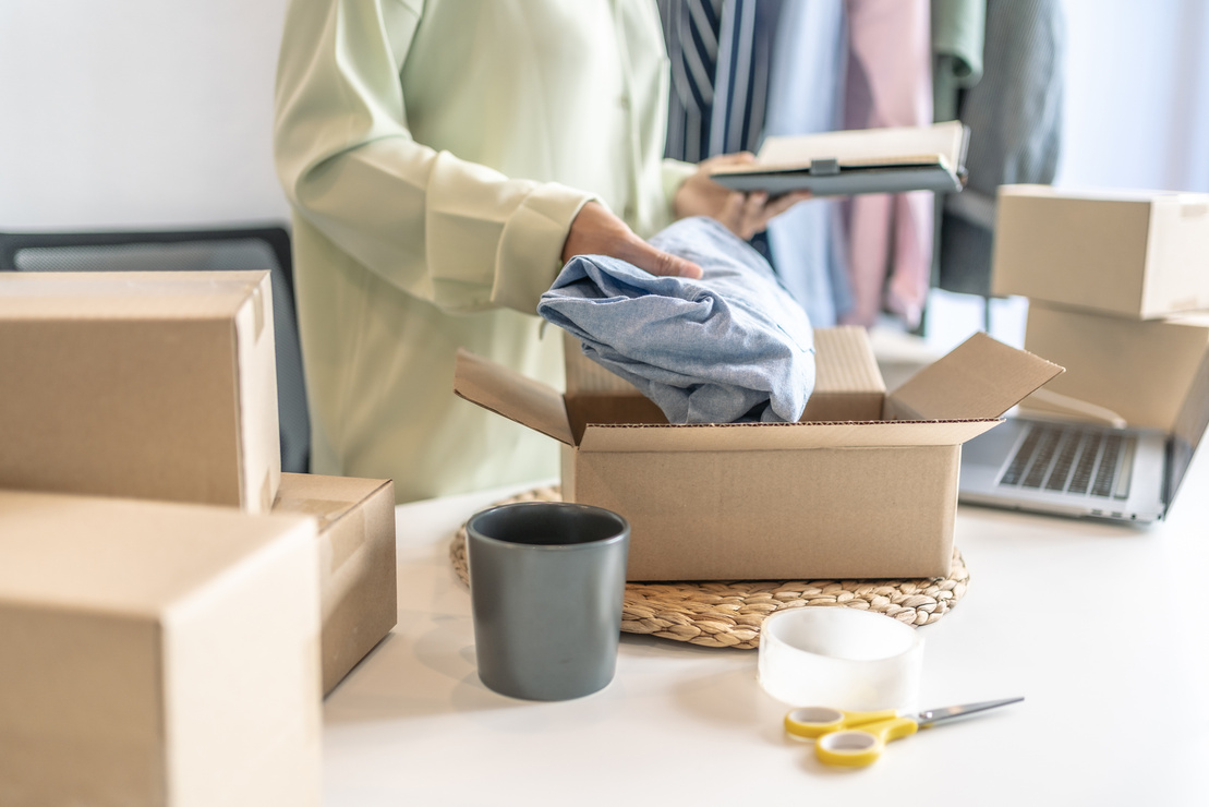 
Small Business Owner Packing Shipment to Clients